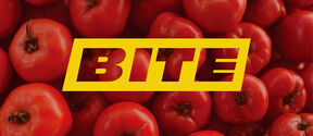 Pile of red tomatoes with bold yellow BITE text across the centre