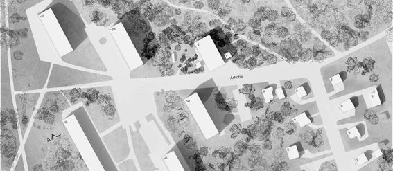 A black and white architectural site plan showing multiple buildings surrounded by trees and roads in a suburban area.