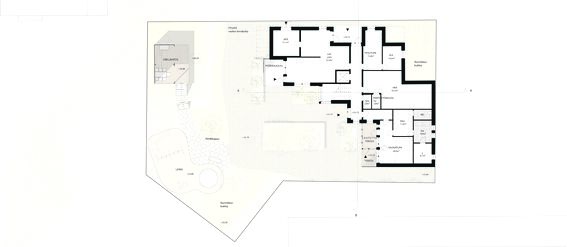 Architectural floor plan showing a detailed layout of a building, outdoor grill area, playground, and surrounding landscape.