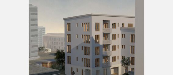 Modern white apartment building with large windows and balconies, surrounded by other buildings. A person cycling at the front.