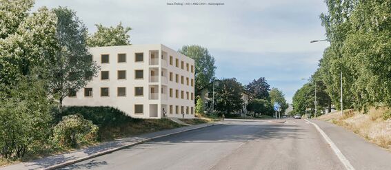 A street view showing a modern building on the left, surrounded by trees and greenery, with a road and street signs on the right.