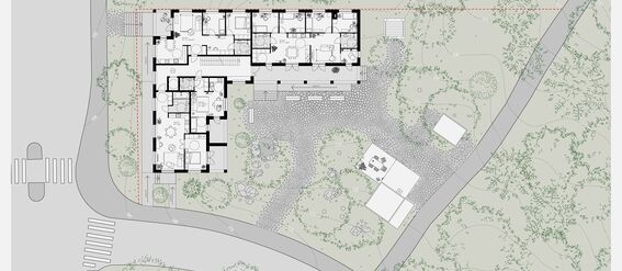 Architectural floor plan of the third floor surrounded by greenery. The layout includes rooms and pathways outside.