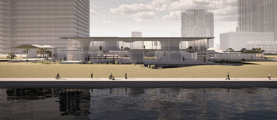 Modern waterfront building with large windows, surrounded by skyscrapers. People walking and cycling along the shore.