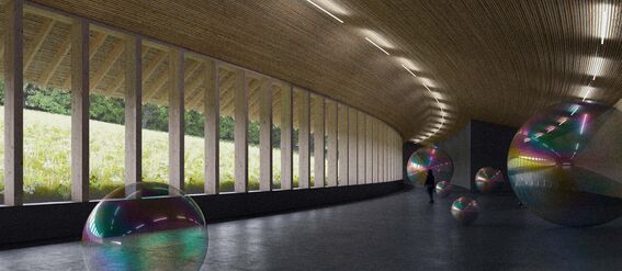 A modern hall with large windows and wooden ceiling, featuring multiple iridescent spheres and a person in the distance.