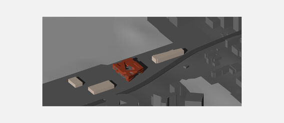 A diagram showing a red building surrounded by grey structures and roads in a simplified urban layout.