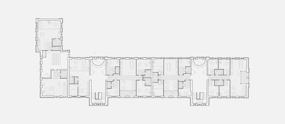 Architectural floor plan of the second floor, showing multiple rooms, corridors, and staircases. Scale: 1:150.