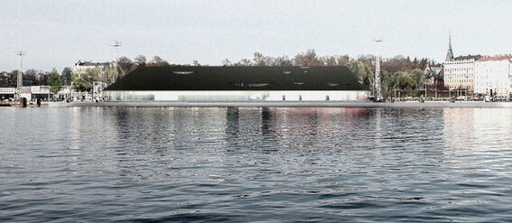 A waterfront view with buildings, trees, and a large dark-roofed structure reflected in the calm water.