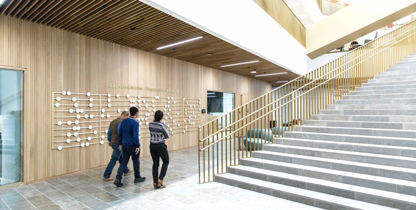 People walking in the lobby of BIZ building