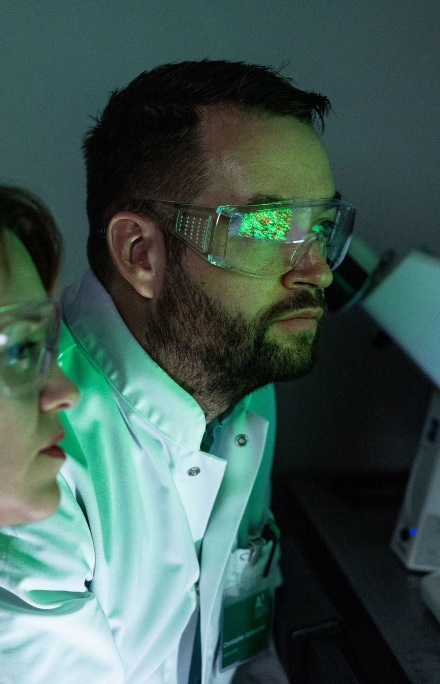 Two researchers in white lab coats