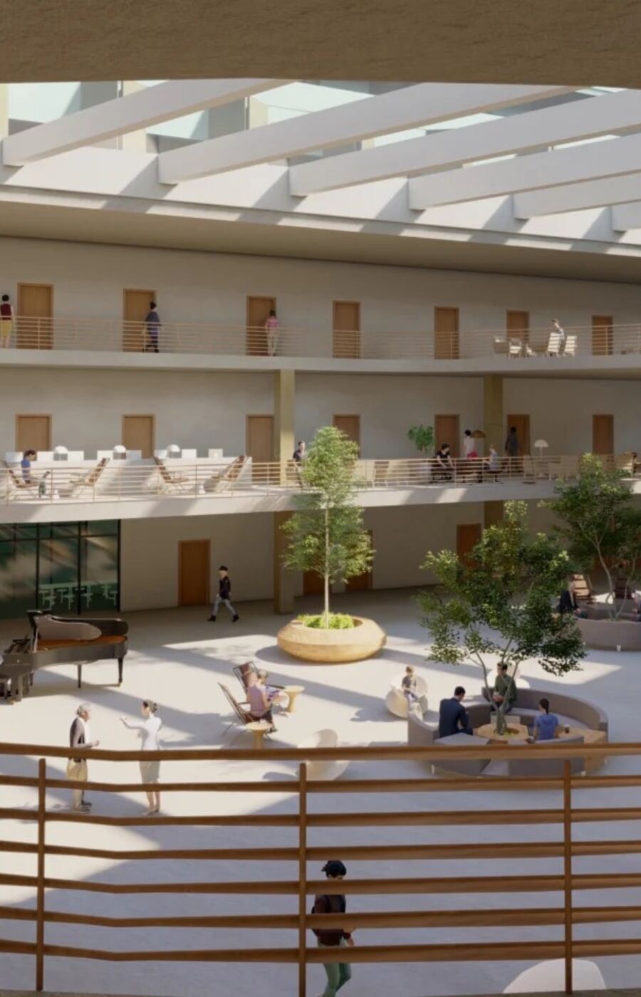 A spacious atrium with a wooden spiral staircase, seating areas, plants, and people walking or sitting.