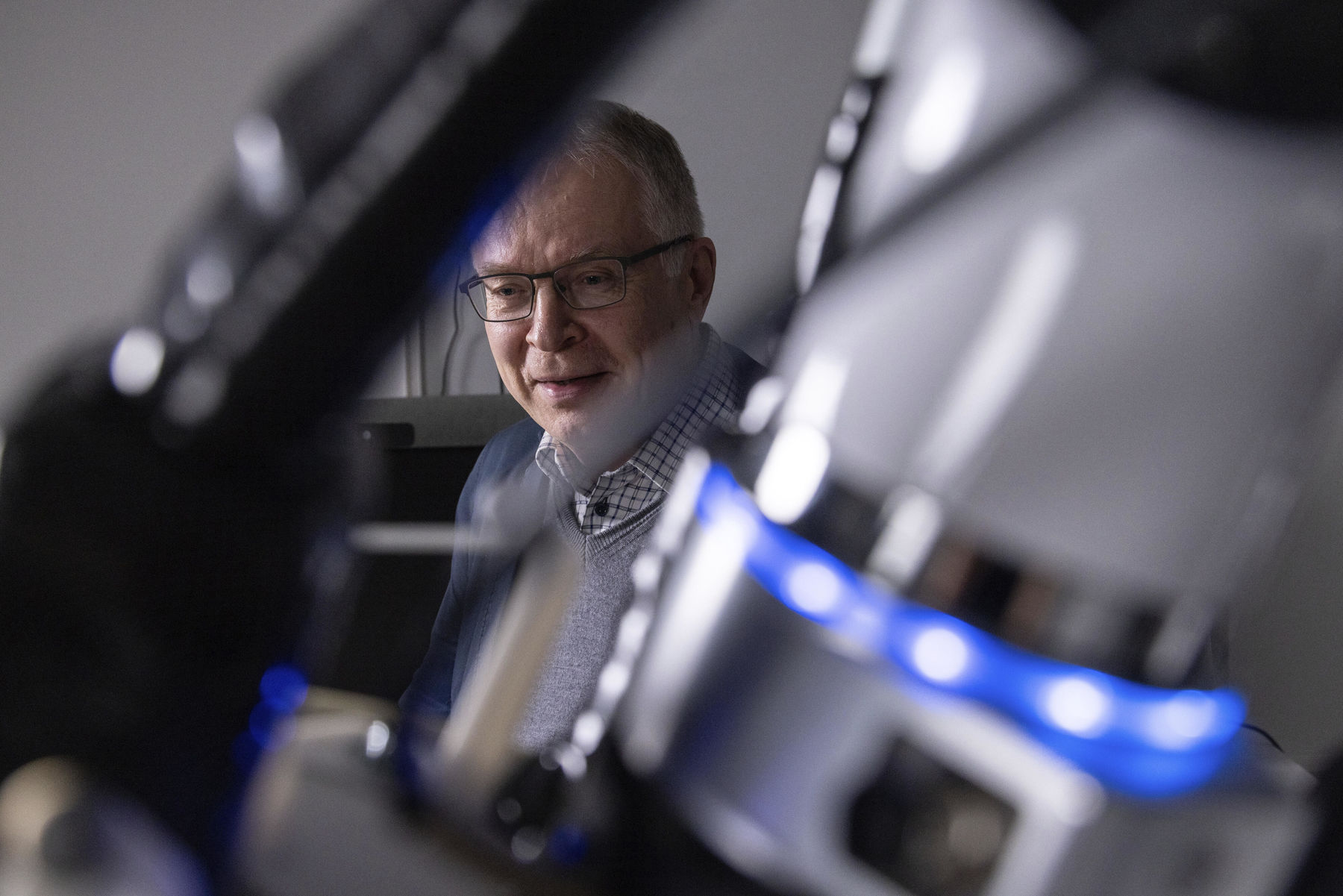 A man standing behind a health tech device