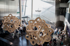 Students photographed through an artwork