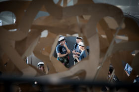 Students photographed through an artwork