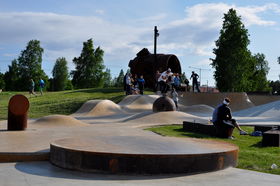 men skateboarding in skatepark
