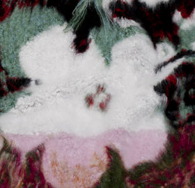 a closeup photo of a rug with flower