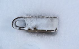 a ceramic cup in snow