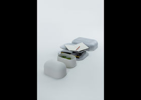 a set of containers made of ceramics and casted aluminium