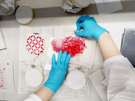 Process image of adding ionic liquid and cellulose solution on fabric with pattern stencil