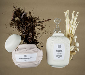 two ceramic pots with some worms and mushrooms