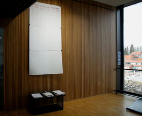 a view from exhibition with art pieces on a table and wall