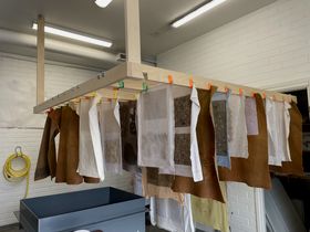 art pieces hanging and drying