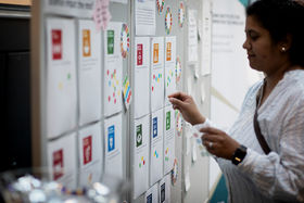 Scientist putting a sticker on paper
