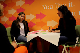 Erasmus+ Staff Training 2023 small group work with three participants sitting and using  post it notes.