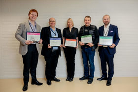 Five people standing next to each other, all Aalto alumni of the year 2023 