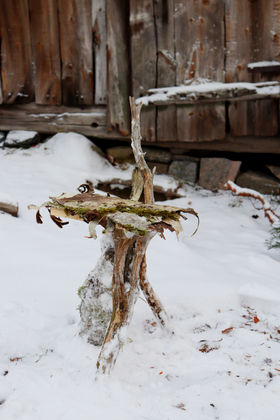 A wooden sculpture made of pieces found in nature