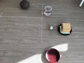 A variety of seaweed ceremony objects carefully placed on the flooe