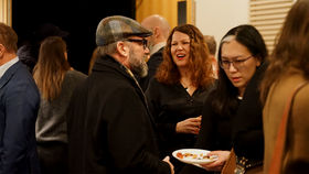 Happy people gathering together after Radical Creatives premier in the US