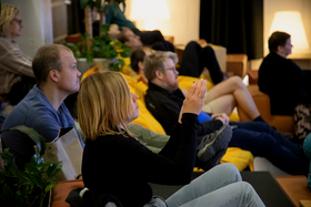 Audience member taking a photo.