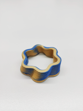Star shaped, blue-yellow, 3D printed ceramic object