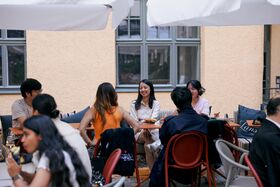 Students networking at a social event by Aalto University Summer School in Helsinki.