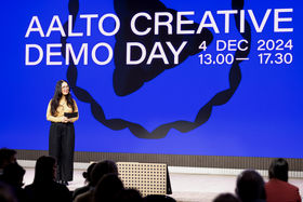 Presenter Katriina Haikala on stage at Aalto Creative Demo Day