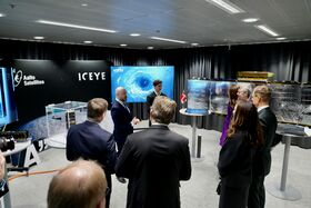 Professor Jaan Praks presenting satellite technology to the guests.