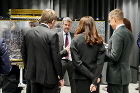 King Frederik X of Denmark is briefd about satellite technology.