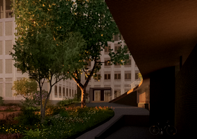 A courtyard with trees and flowers, adjacent to a modern building. A bicycle is parked near a curved pathway.