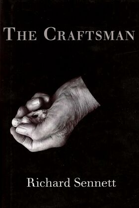 Cover of 'The Craftsman' by Richard Sennett, featuring a black and white image of a hand holding a small object.