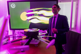 A startup founder behind their product at Demo Day 2025