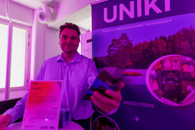 A startup founder showcasing their product at Demo Day 2025