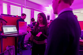 A startup founder behind their product at Demo Day 2025