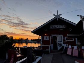 Cafe by the sea at sunset