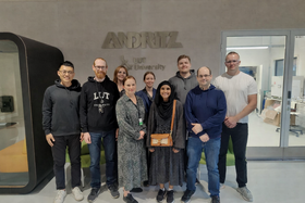 Wood Extractives group posing in front of the Andritz LUT University logo