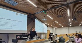 Interns listening to a research lecture 