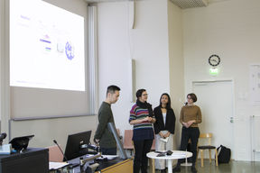 Creative Sustainability student group presenting their solution in front of a class.