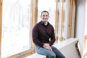 Michael smiling in Dipoli building