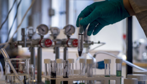Precious metals in crushed batteries being dissolved in a test tube