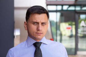 Professor Paler infront of the Comptuer Science department