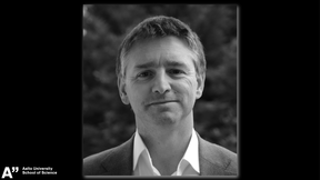 portrait photo of Prof. Nuno Peres in black and white on a black background